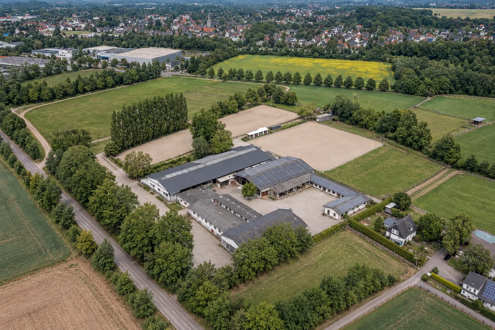 Professional equestrian facility with stables, arenas and paddocks from the air